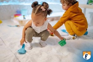 wela crossing midline toddlers playing with shovels
