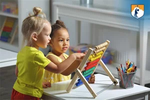 Westcliff Early Learning Academy - preschool girls learning to use abacus