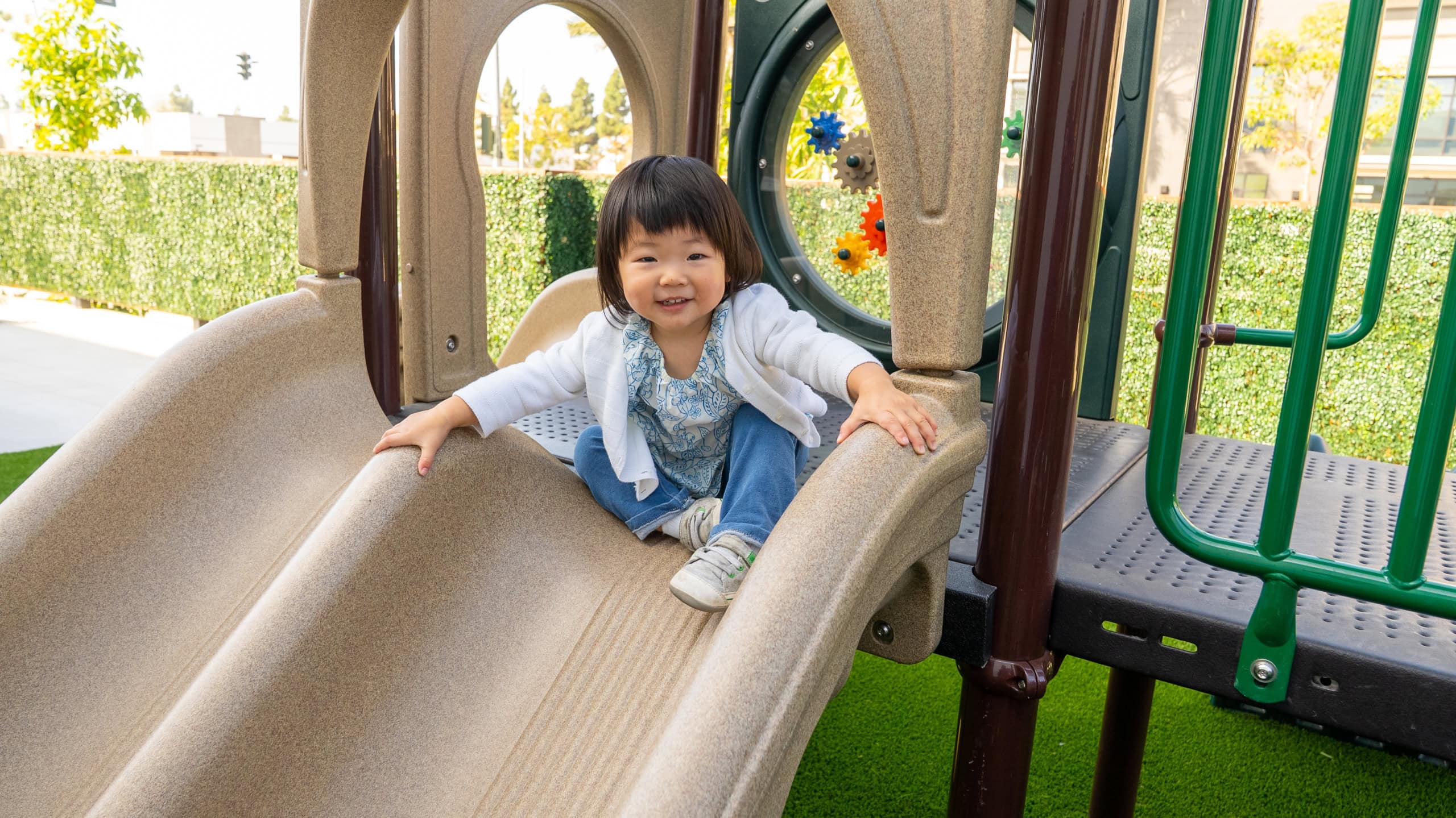 WELA Open House, December: December Around the World: A Cultural Mini Fair. A boy at the playground.